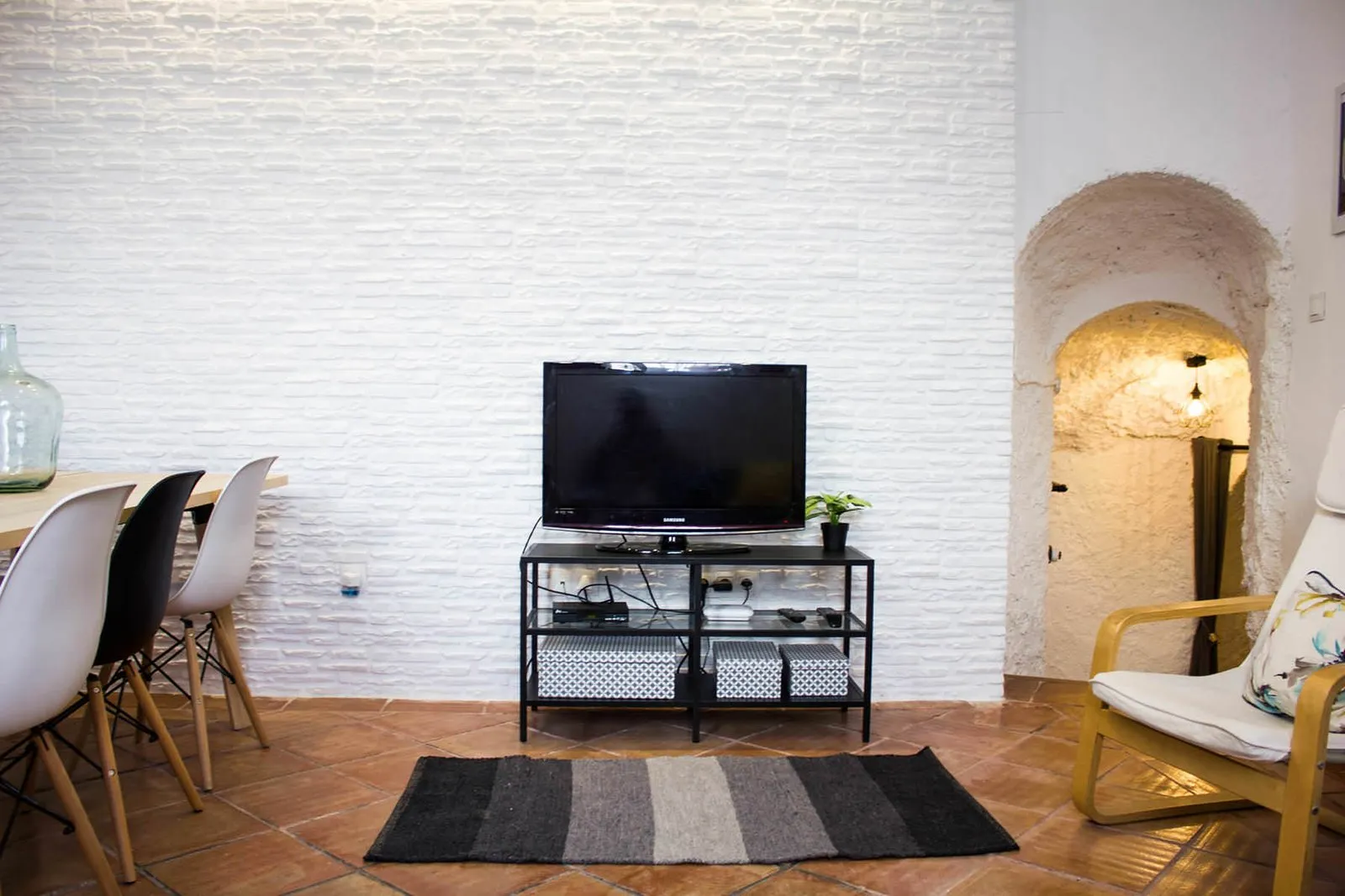 Living room TV unit and the arched entrance to the cave