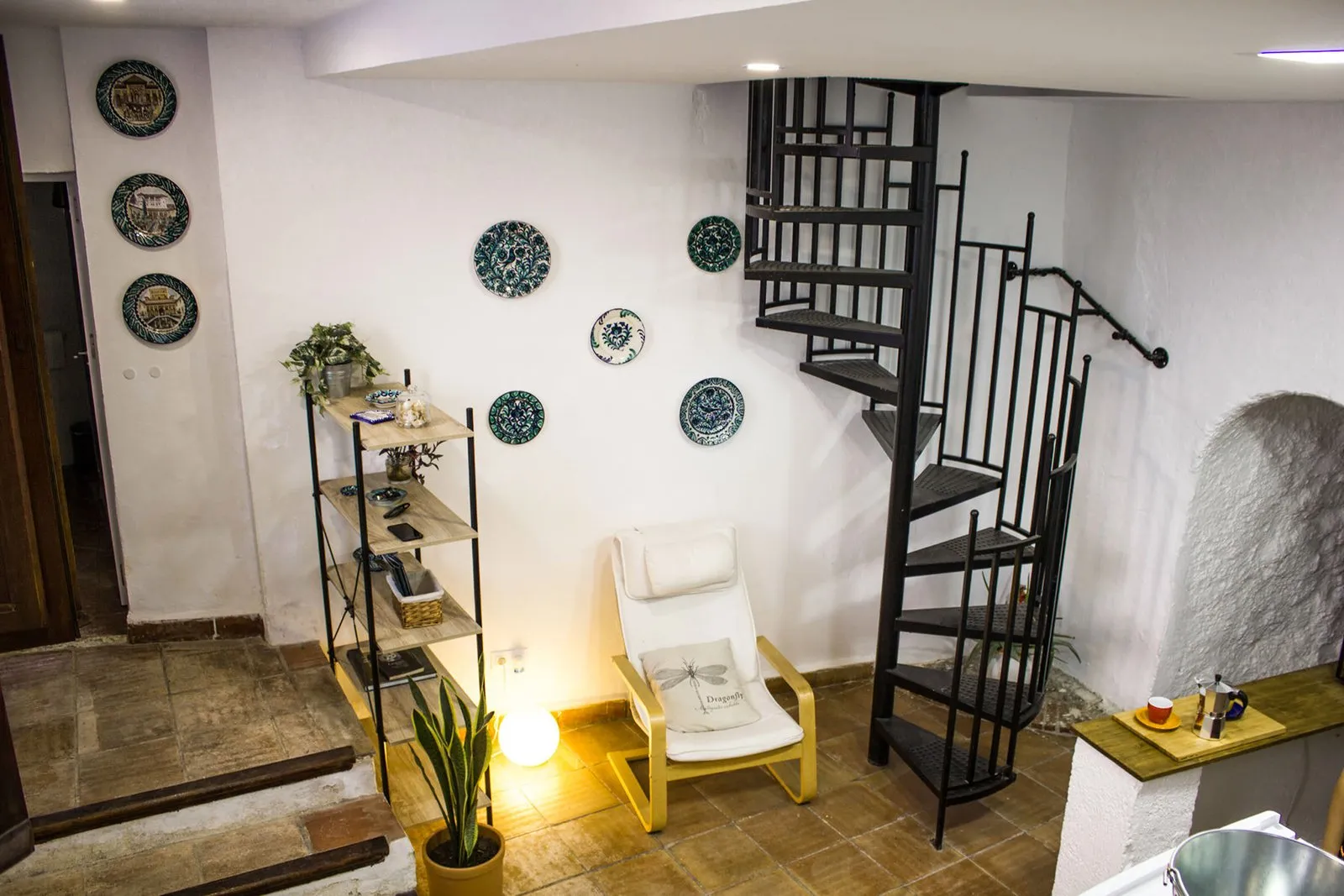Spiral staircase and Granada ceramic plates on the wall