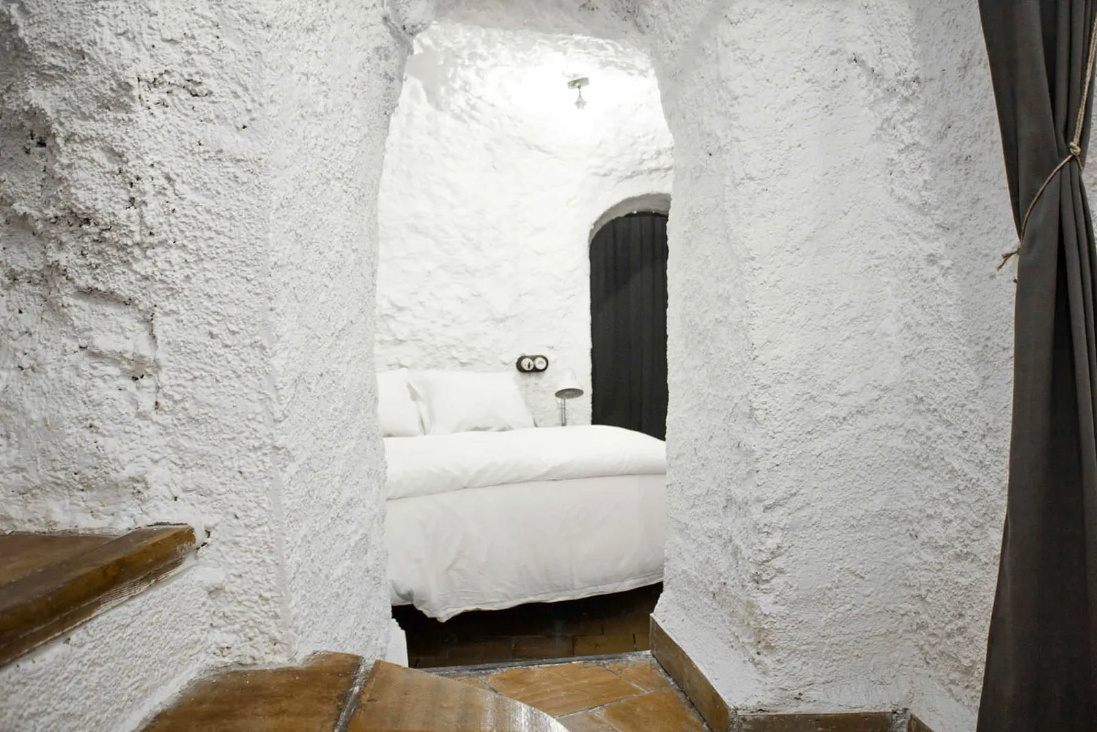 Rock-cut passage leading to a bedroom