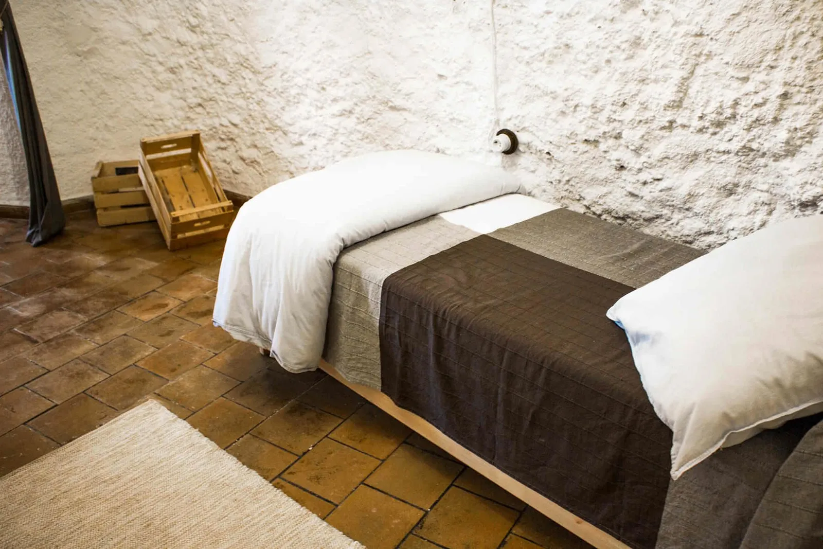 Wooden single bed in the Sala de Dos Hermanas