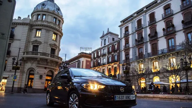 Black Uber car driving through Granada
